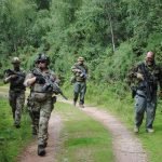 Airsoft players moving down a path