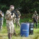 An airsoft player reloading