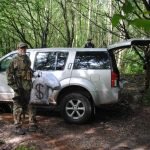 Airsofters around a car