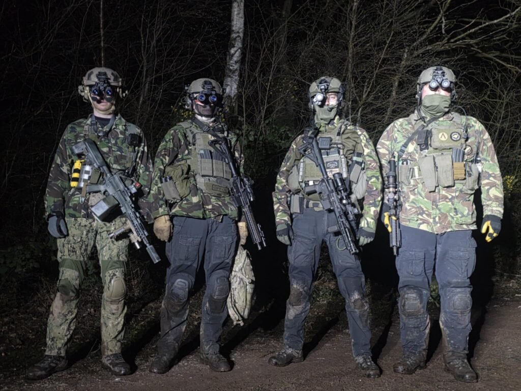 Four airsoft players on a night vision game at The Kingdom