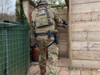 Airsoft player on a building at The Kingdom