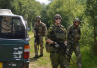 Three airsoft players with a Ford Ranger at The Kingdom, Staffordshire